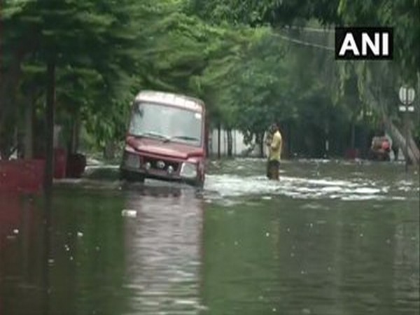 A vehicle wading through a water-logged road of Bihar. [Photo/ANI]