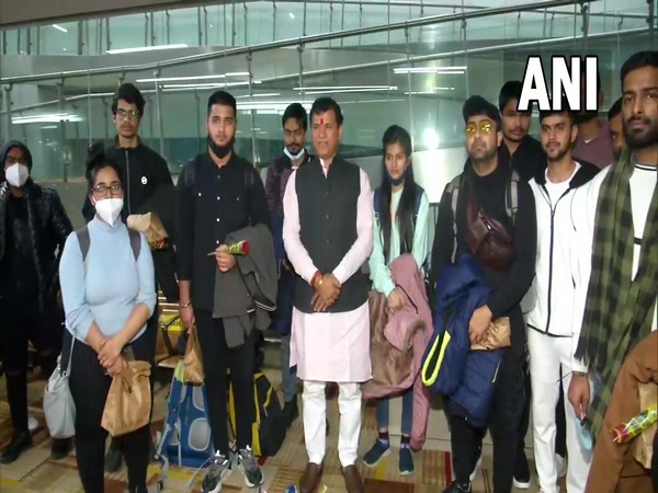 Indian students with MoS Kailash Choudhary at Delhi airport (Photo/ANI)
