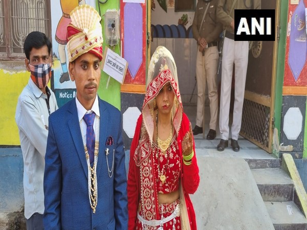 A newly married woman cast her vote in Firozabad before departing for in-laws house. (Photo/ANI)