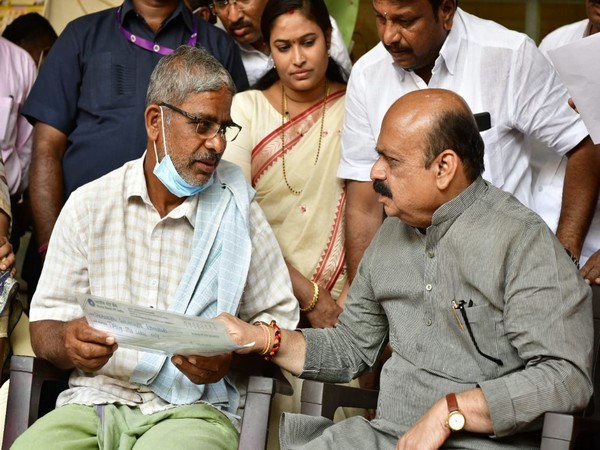 Karnataka Chief Minister Basavaraj Bommai with Naveen Shekharappa's family