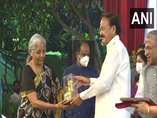 Rajya Sabha Chairman Venkaiah Naidu presents mementoes to Union Minister Nirmala Sitharaman (Photo:ANI)