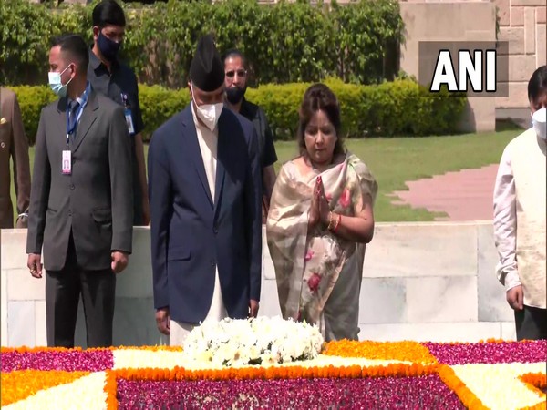 Nepal PM Sher Bahadur Deuba with his wife Arzu Deuba pays tribute to Mahatma Gandhi at Raj Ghat