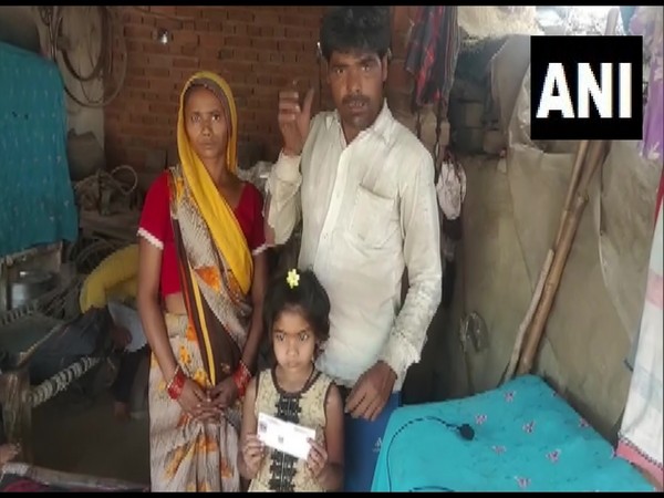 The girl with her family in UP's Badaun (Photo/ANI)