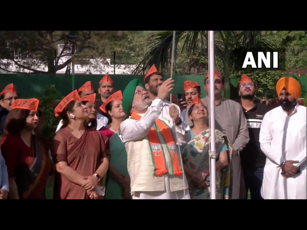 Union Minister Hardeep Singh Puri unfurls the BJP's flag at his residence, on the party's  42nd foundation day today.