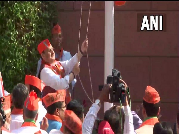 BJP national president JP Nadda hoists the party flag at their headquarters in Delhi on the party's 42nd foundation day today.