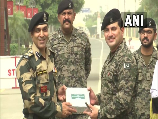 BSF and Pakistan Rangers exchanging sweets at JCP Attari border, Punjab