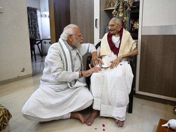 Prime Minister Narendra Modi meets his mother Heeraben Modi at her residence in Gandhinagar on Saturday. (Photo/ANI)