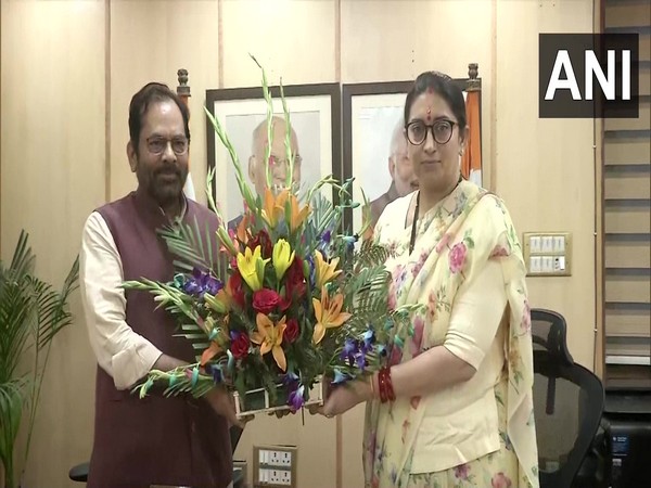 BJP leaders Mukhtar Abbas Naqvi and Smriti Irani (Photo/ANI)