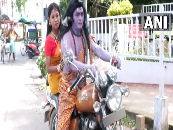 Man and a woman dressed up as Lord Shiva and goddess Parvati protesting in Assam's Nagaon (Photo/ANI)