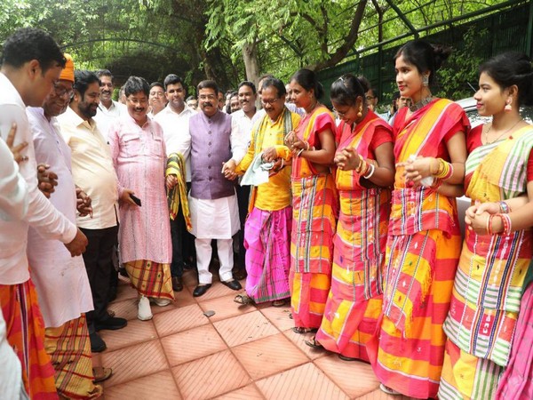 Union Education Minister Dharmendra Pradhan with folk artists at his residence in Delhi