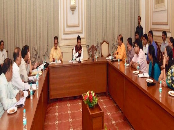 Maharashtra Chief Minister Devendra Fadnavis heading a meeting to resolve Aadharwadi dumping ground issue. Photo/ANI