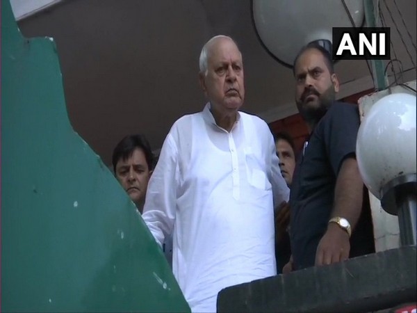 National Conference leader Farooq Abdullah speaking to reporters from his house in Srinagar