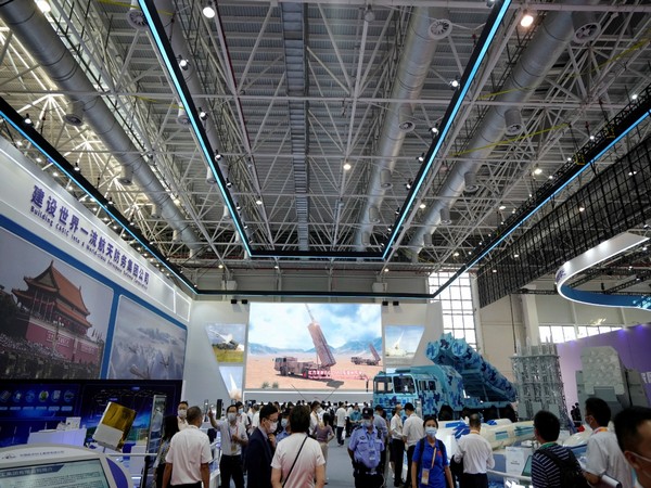 Visitors stan at the booth of China Aerospace Science & Industry Corporation Limited (CASIC) at the China International Aviation and Aerospace Exhibition, or Airshow China, in Zhuhai