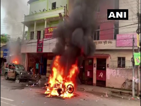 Visuals of a vehicle on fire in Agartala on Wednesday. (Photo/ANI)