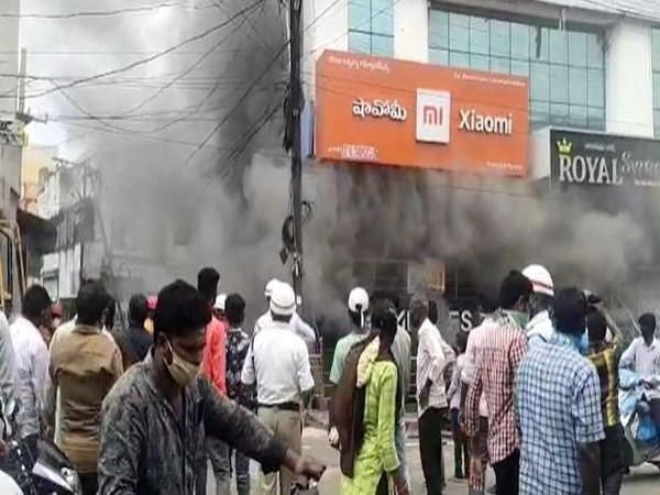 Fire breaks out in a mobile store in Andhra Pradesh on Monday. [Photo/ANI]