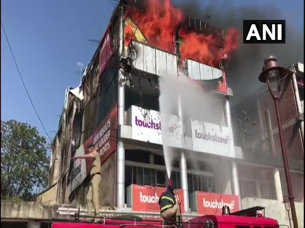 Fire fighter trying to douse the fire in Chandigarh on Monday. Photo/ANI