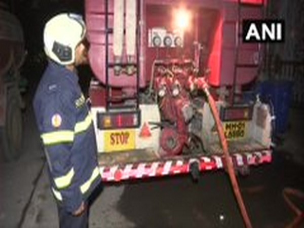 A firefighter stands on the spot in Mumbai on Thursday. Photo/ANI