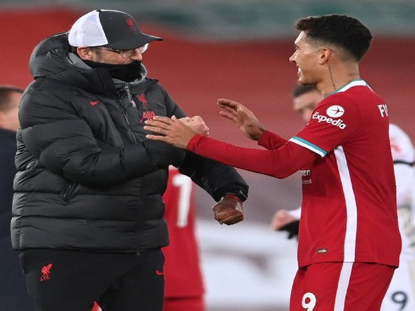 Jurgen Klopp with Roberto Firmino (Photo/ Liverpool FC Twitter)