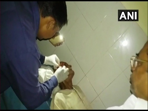 Patient being treated under phone's flashlight in hospital in Firozabad. Photo/ANI
