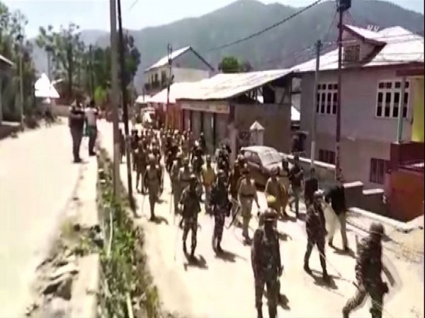 Security forces on Saturday carried out flag march in Kishtwar, Jammu and Kashmir. Photo/ANI