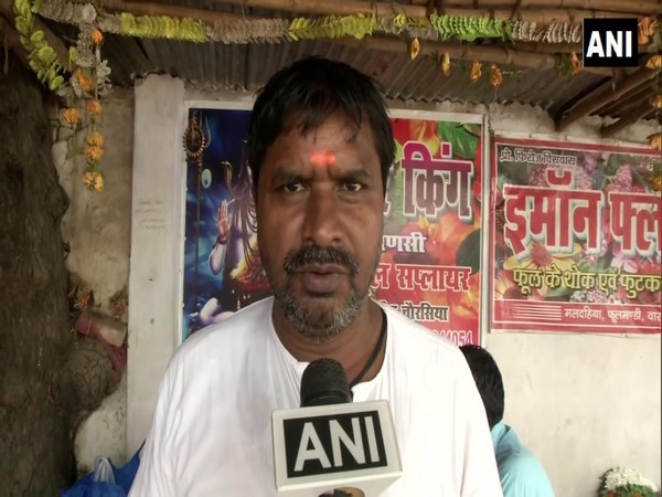 A flower seller in Varanasi, Uttar Pradesh, talking to ANI on Saturday.