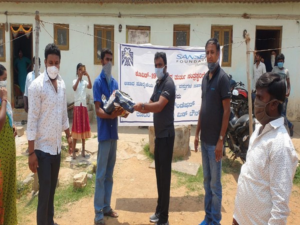 Food grain kit distribution by Sansera