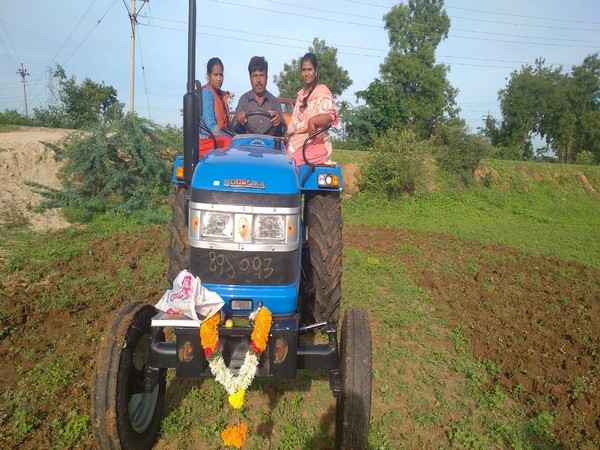 Nageswara Rao, a farmer from Chittoor district, driving his new tractor gifted by actor Sonu Sood.