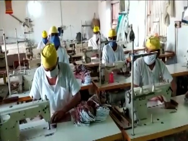 Prisoners at Vadodara Central Jail stitching face masks. (Photo/ANI)