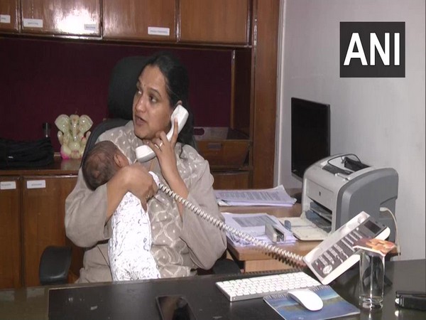 GVMC Commissioner, G Srijana, at her office with her newborn on Sunday.