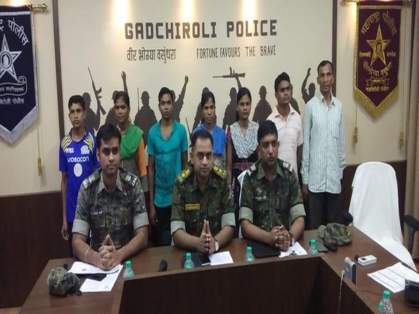 The surrendered Naxals with the Gadhchiroli police team on Wednesday. Photo/ANI