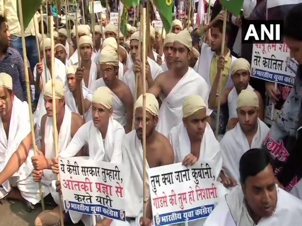 Youth Congress workers dressed as Mahatma Gandhi protest against Pragya Thakur in New Delhi on Friday. Photo/ANI