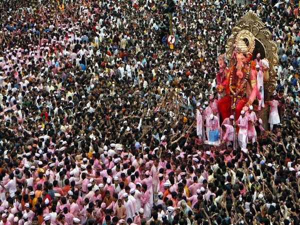 Devotees carry a statue of Ganesha, the deity of prosperity and knowledge