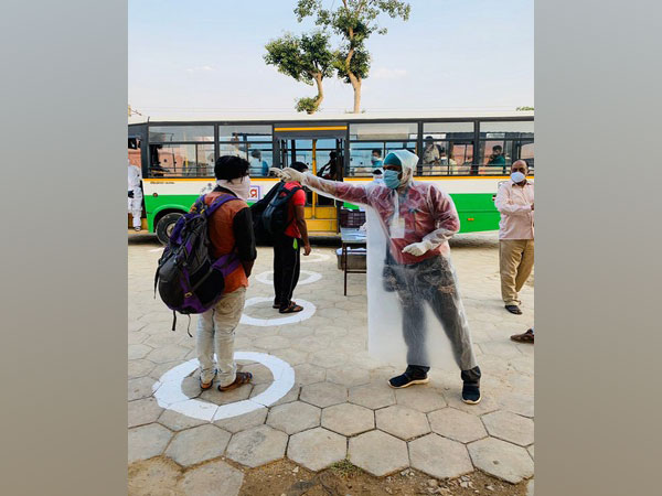 A health official checks temperature of a migrant who arrived from Kerala on Sunday. Photo/Twitter