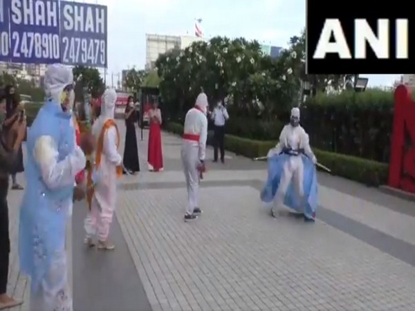 A group of fashion designing students perform garba wearing PPE kits in Surat, Gujarat. (Photo/ANI)