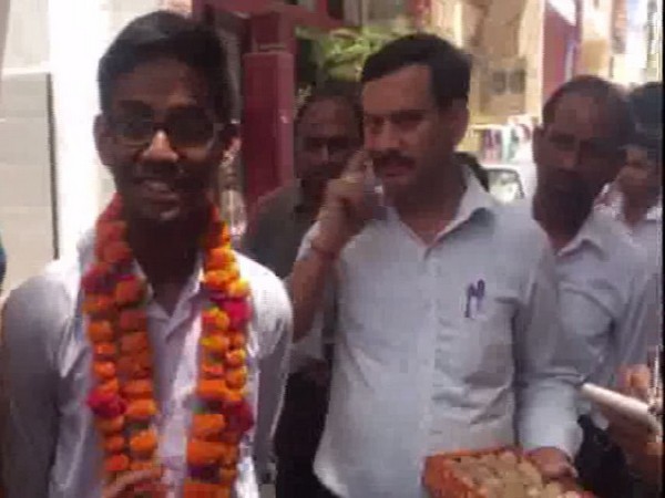 UP state board High School topper Gautam Raghuvanshi talking to reporters (Photo/ANI)