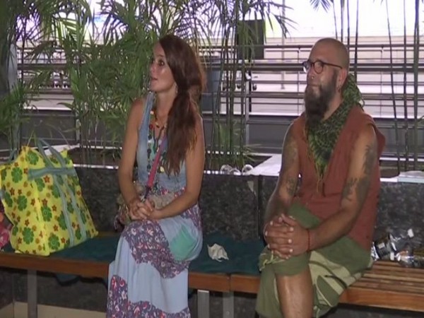 A German couple waiting for the flight at Delhi Airport on Saturday. Photo/ANI