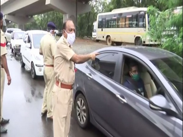 Goa police team led by North Goa Superintendent of Police Utkrisht Prasoon monitors the movement of vehicles on Friday. (Photo/ANI)
