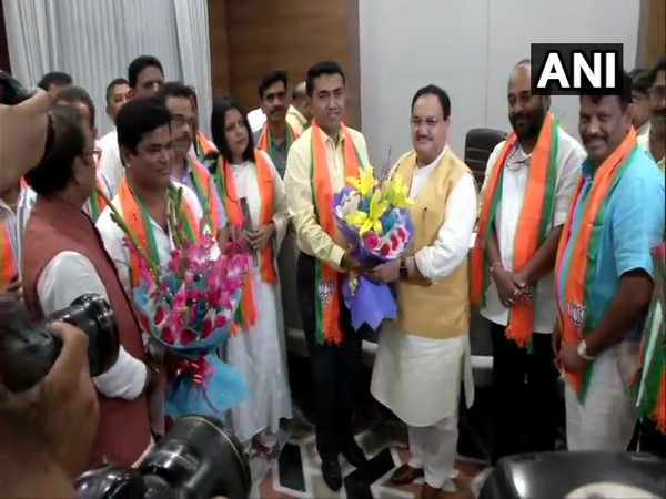 Ten former Congress MLAs while joining the BJP here in New Delhi on Thursday. Photo/ANI