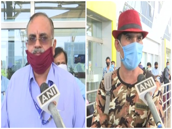 Goa International Airport Director Gagan Malik, left, and Gokalanand Tiwari, one of the passengers, speaking to ANI on Monday.  Photo/ANI