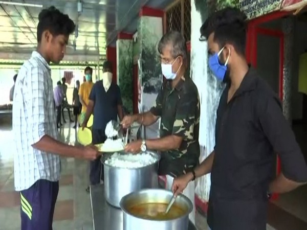 People staying at the hostel being served food. Photo/ANI