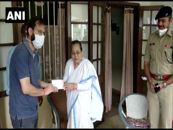 Shanti Gogoi handed over the cheque to Dibrugarh DC on Friday. Photo/ANI