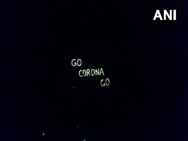 People flash 'GO CORONA GO' in Ahmedabad on Sunday night. Photo/ANI