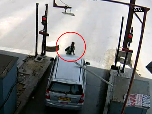 A video grab of CCTV footage of the car which drives away with toll plaza employee on car's bonnet. (File Photo)