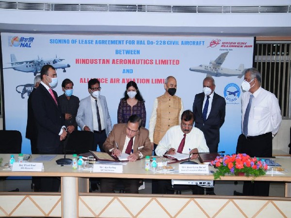 Officials of HAL and Air Alliance signing the deal (Photo/ANI)