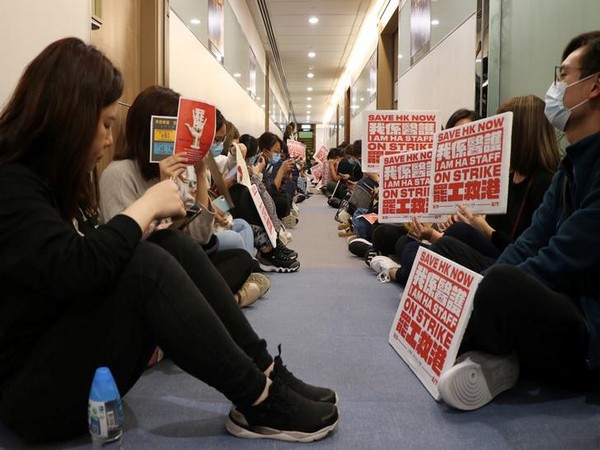Medical workers wait at a corridor to demand an open dialogue on the novel coronavirus with the senior management, at the Hospital Authority's headquarters in Hong Kong