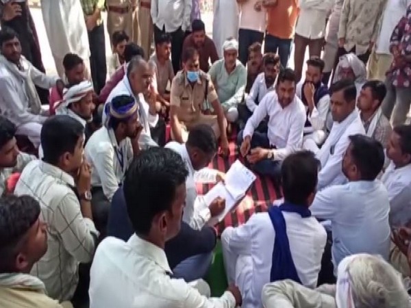 Villagers hold sit-in protest outside Pilibanga Police Station in Hanumangarh (Photo/ANI)