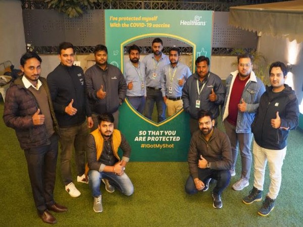 Members of Healthians staff after getting vaccinated for COVID-19