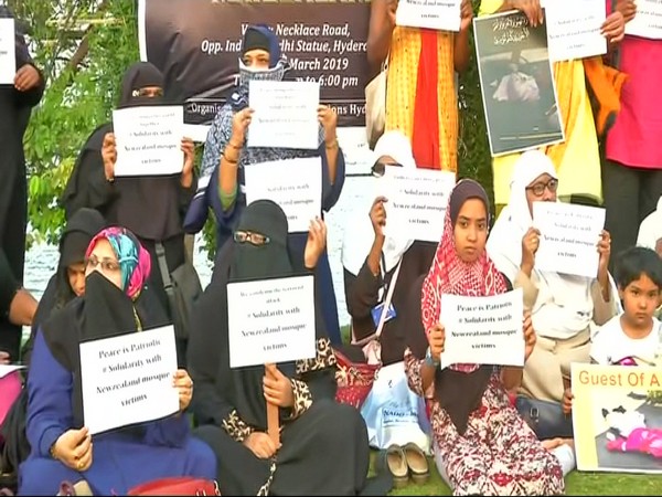 Women holding posters in Hyderabad on Saturday.