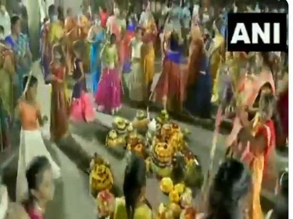    Women gather and dance around Batukammas in several places in Hyderabad. Photo/ANI