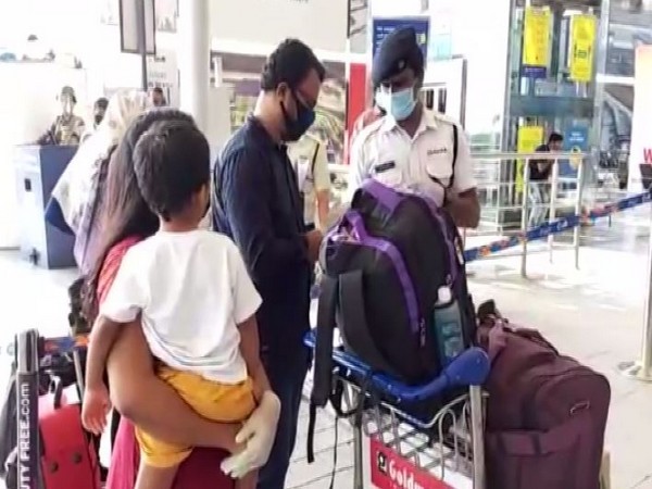 Passengers enquire about the flights at Hyderabad Airport on Monday. Photo/ANI